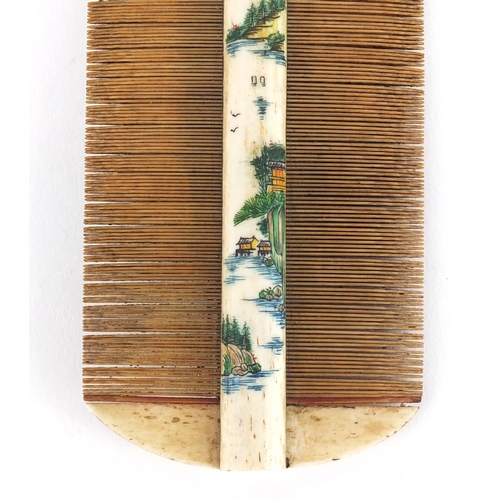 481 - Chinese part stained bone and bamboo comb carved with a landscape and calligraphy, 10.5cm wide