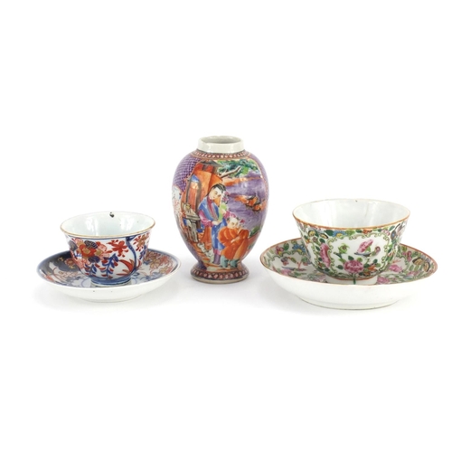 409 - Chinese porcelain including a Cantonese tea bowl with saucer and a mandarin palette vase, the larges... 