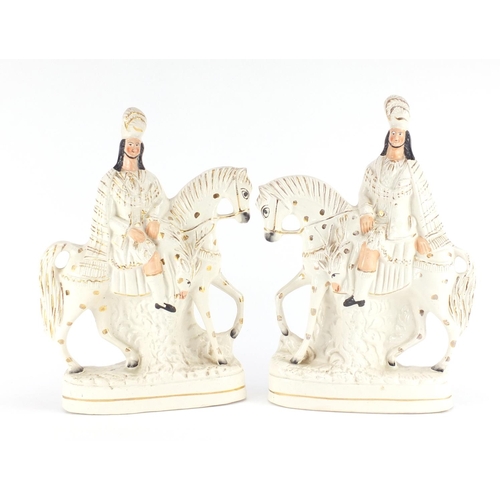 618 - Pair of Victorian Staffordshire flat back figures of figures on horsebacks, the largest 38cm high