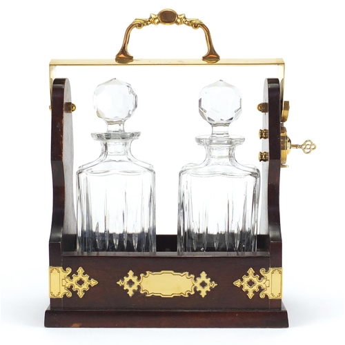 2445 - Brass mounted mahogany two bottle tantalus with key, 36cm high