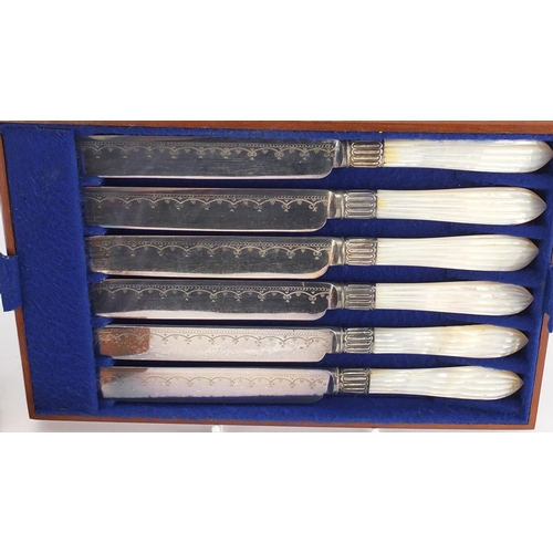 2299 - Set of six silver plated fish knives and forks with mother of pearl handles, housed in a fitted maho... 