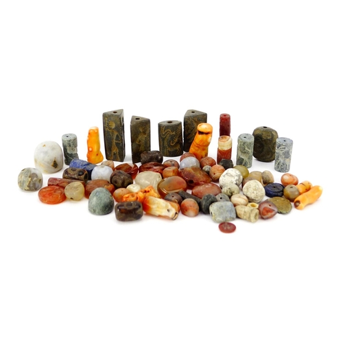 534 - Collection of beads and stones including Islamic carved agate examples, the largest approximately 3.... 