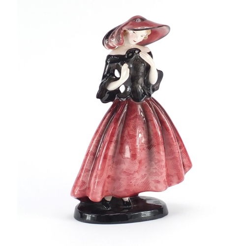 712 - Austrian Art Deco figurine of a girl wearing a pink hat and dress by Goldscheider, factory marks and... 