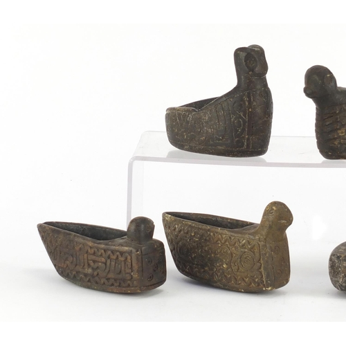 531 - Five Islamic carved stone bird design oil lamps and one other, the largest 17cm in length