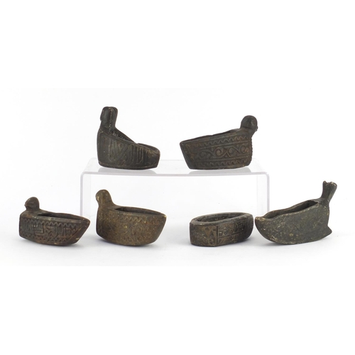 531 - Five Islamic carved stone bird design oil lamps and one other, the largest 17cm in length
