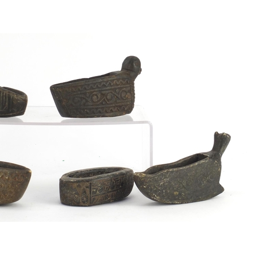 531 - Five Islamic carved stone bird design oil lamps and one other, the largest 17cm in length