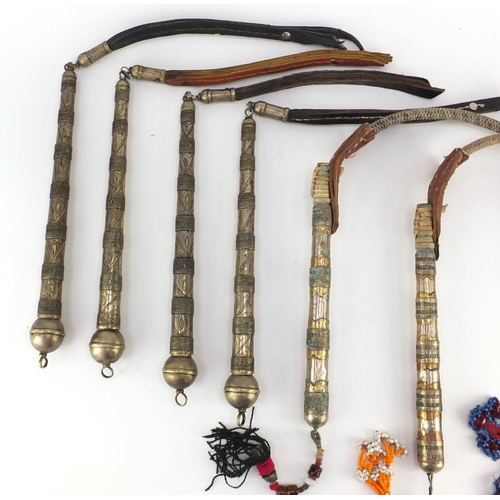 583 - Seven Afghan white metal and coppered Buzkashi whips