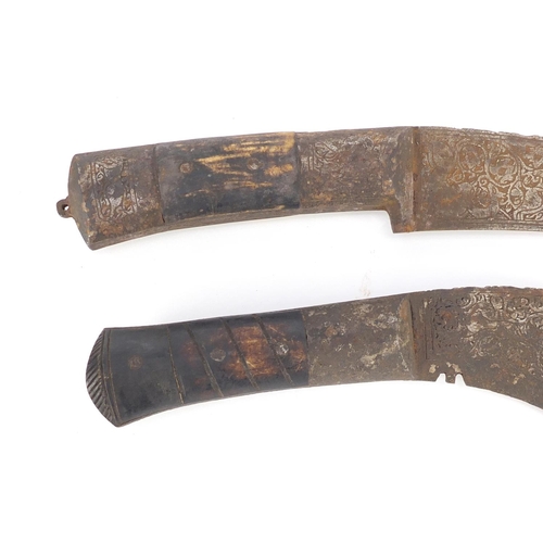 596 - Two Islamic Afghan Pesh Kabz daggers with sheaths, bone handles and steel blades engraved with mythi... 