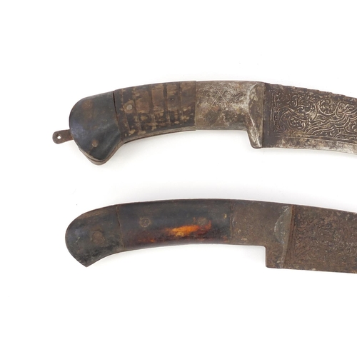 595 - Two Islamic Afghan Pesh Kabz daggers with sheaths, bone handles and engraved steel blades, the large... 