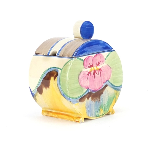 696 - Clarice Cliff Pansy Delicia jam pot and cover, factory marks to the base, 10.5cm high