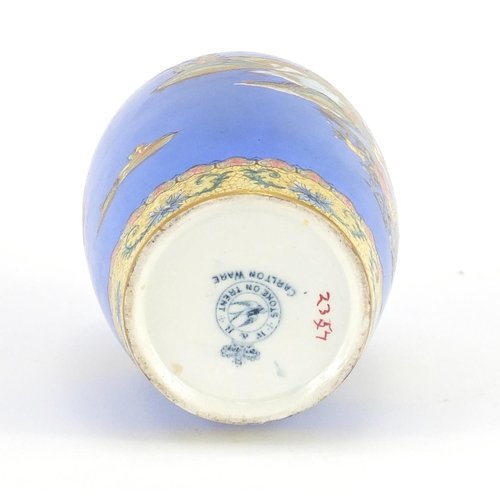 702 - Carlton Ware jar and cover, hand painted and gilded in the Temple pattern, 18cm high