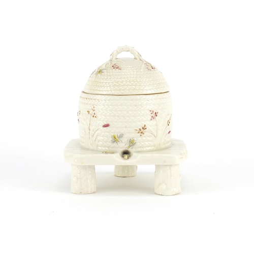 628 - Early Belleek beehive design preserve pot and cover, hand painted with bees, factory marks to the ba... 