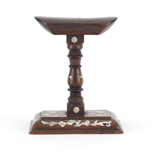 473 - Chinese carved hardwood headrest, inset with mother of pearl, 15cm high