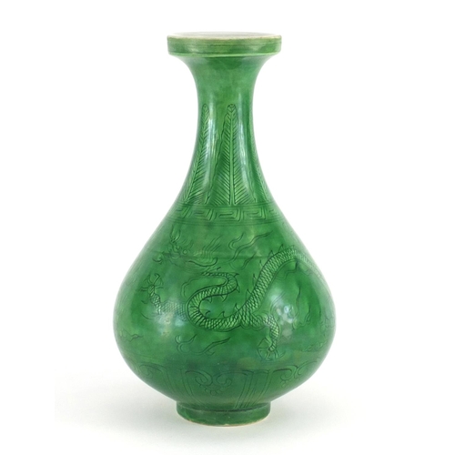 415 - Chinese porcelain green glazed disc top vase, incised under glaze with a dragon and phoenix chasing ... 