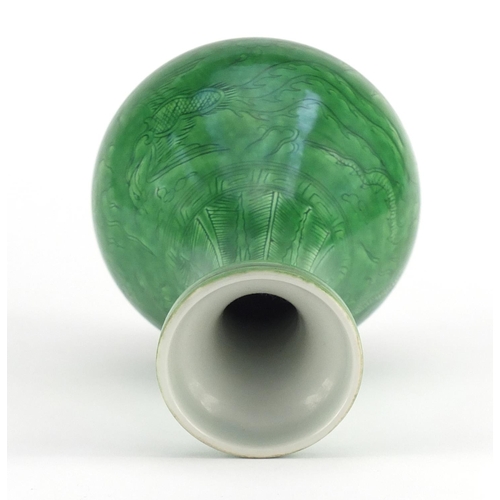 415 - Chinese porcelain green glazed disc top vase, incised under glaze with a dragon and phoenix chasing ... 