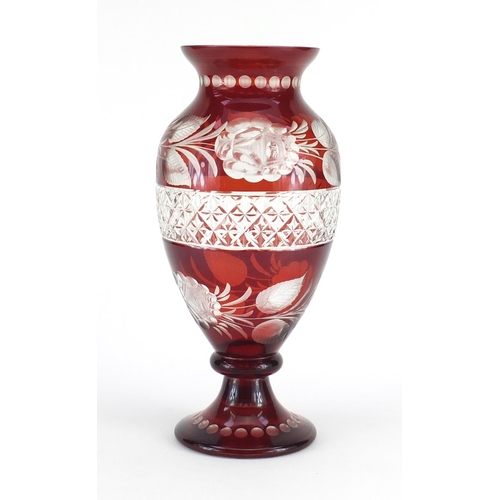 660 - Bohemian ruby glass vase with cut glass roses and a central band of criss cross patterning, 31cm hig... 