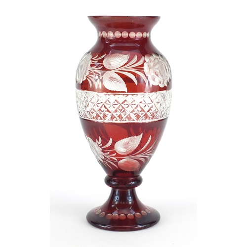 660 - Bohemian ruby glass vase with cut glass roses and a central band of criss cross patterning, 31cm hig... 