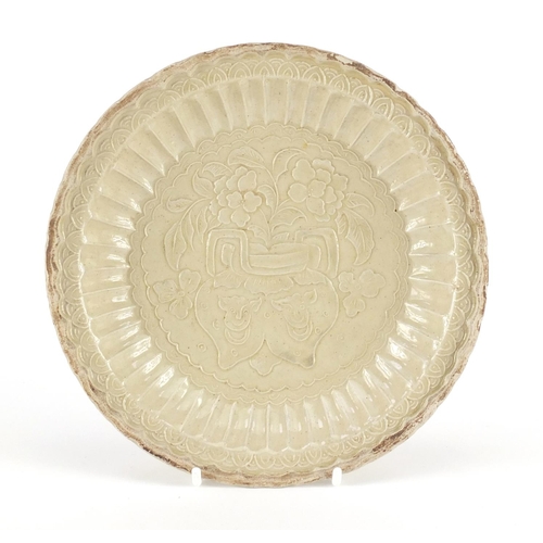 437 - Chinese Ding Ware porcelain fluted dish, decorated in low relief with flowers, 18cm in diameter