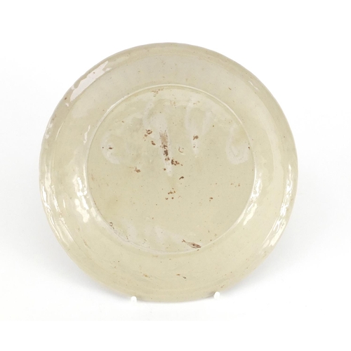 437 - Chinese Ding Ware porcelain fluted dish, decorated in low relief with flowers, 18cm in diameter