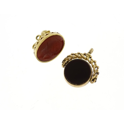 867 - 9ct gold lion design carnelian seal and a 9ct hardstone spinner fob, 14.4g