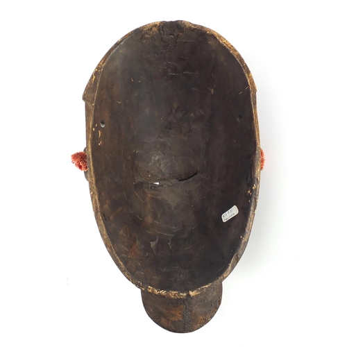 607 - Tribal interest carved wood Bambara warrior mask from Mali, 33cm high