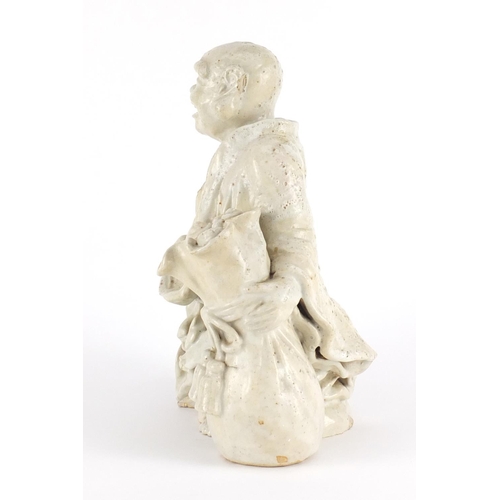 436 - Chinese Blanc de Chine porcelain figure of a  monk, 25cm high