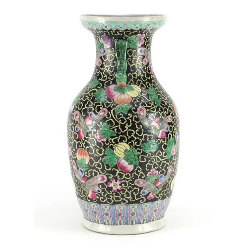 372 - Chinese porcelain vase with twin handles, hand painted in the famille noir palette with butterflies ... 