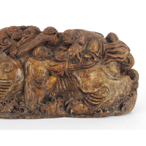 496 - Chinese russet soapstone carving of a dragon with figures, 22cm wide