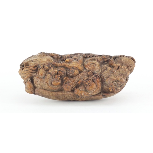 496 - Chinese russet soapstone carving of a dragon with figures, 22cm wide