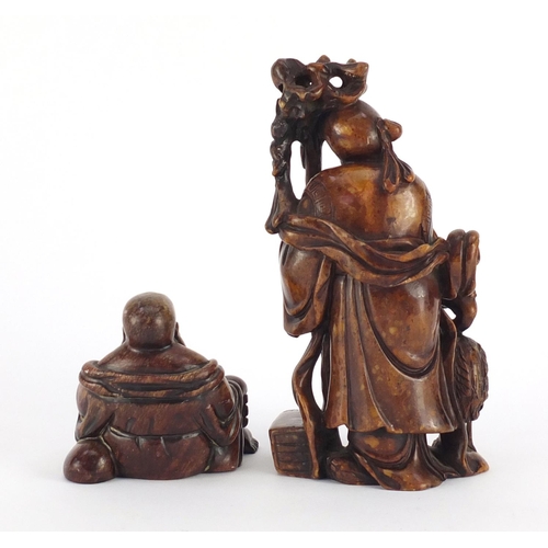 495 - Two Chinese russet soapstone carvings including one of an elder, character marks to the base, the la... 