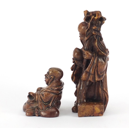 495 - Two Chinese russet soapstone carvings including one of an elder, character marks to the base, the la... 