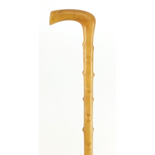 70 - 19th century carved rhinoceros horn parasol handle, 61.5cm in length, 82.0g