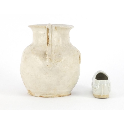 421A - Chinese celadon glazed slipper and a white glazed jug, the largest 11cm high