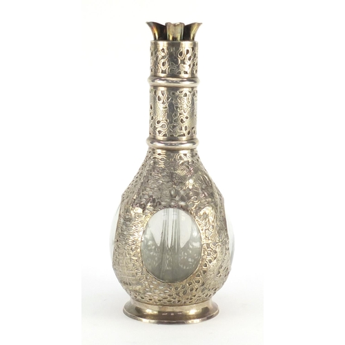 478 - Chinese four chamber glass decanter with sterling silver overlay, pierced and embossed with dragons ... 