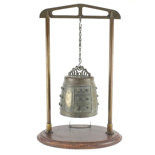 468 - Antique Sino-Tibetan bronze temple bell on later stand, overall 64cm high, the bell 22cm high