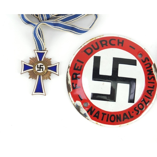 279 - German Militaria including a circular enamel plaque and mothers cross
