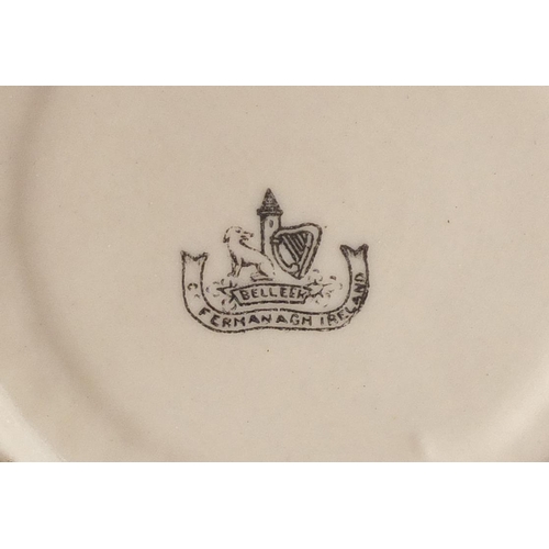 629 - Belleek porcelain including teapot, trio's, side plates and a cauldron, the teapot 12.5cm high