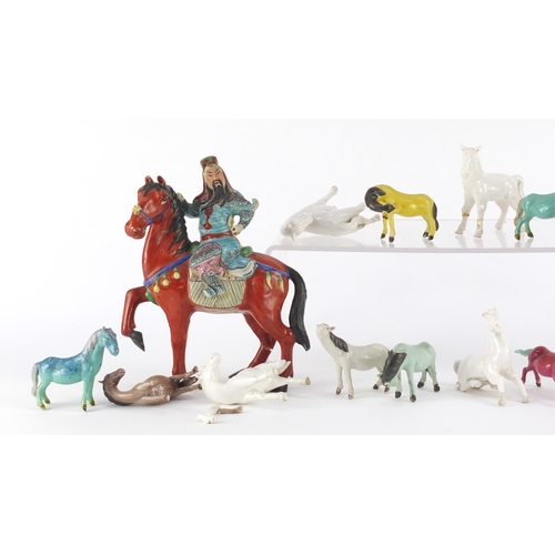 411 - Collection of Chinese porcelain horses including a pair with figures on horsebacks, mostly hand pain... 