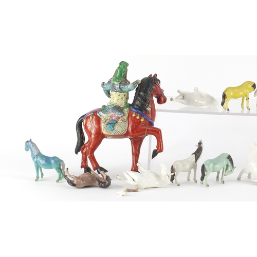 411 - Collection of Chinese porcelain horses including a pair with figures on horsebacks, mostly hand pain... 