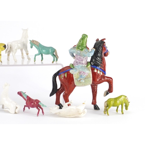 411 - Collection of Chinese porcelain horses including a pair with figures on horsebacks, mostly hand pain... 