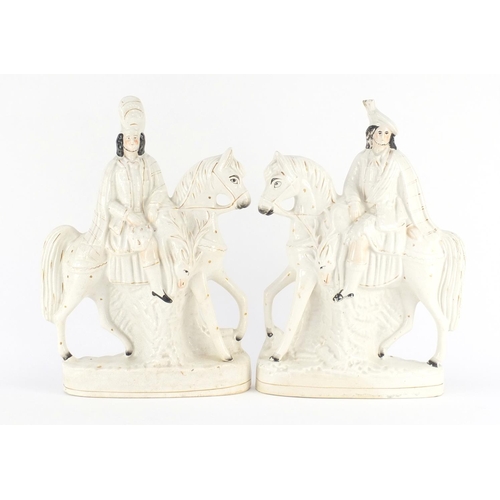 619 - Pair of Victorian Staffordshire flat back figures of figures on horsebacks, the largest 38cm high