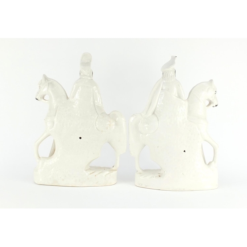 619 - Pair of Victorian Staffordshire flat back figures of figures on horsebacks, the largest 38cm high
