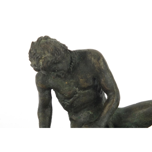 29 - Classical patinated bronze of the Dying Gaul, raised on a rectangular wooden base, 16.5cm wide