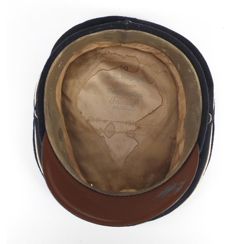 293 - German Military interest visor cap, bearing a J B Holzinger stamp to the interior