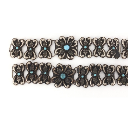 513 - Islamic silver coloured metal flower head design wedding belt inset with turquoise, 80.5cm wide, 180... 