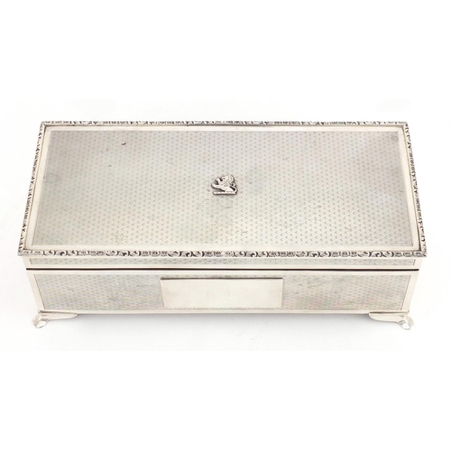 766 - Good quality rectangular silver cigar box with engine turned decoration and lion crest, by Harman Br... 