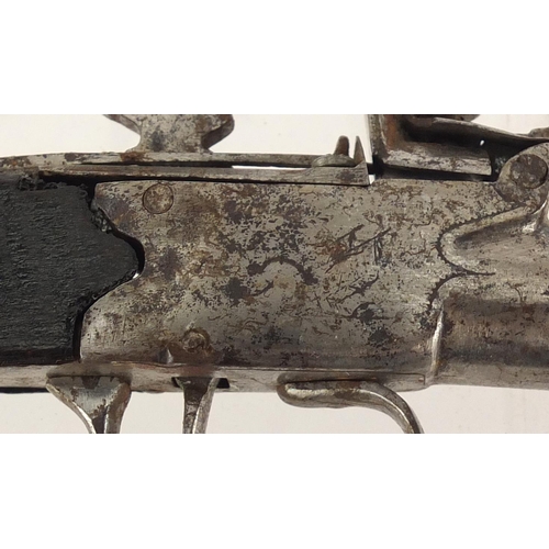 326 - Antique flintlock pistol, with engraved steel plate, 16.5cm in length