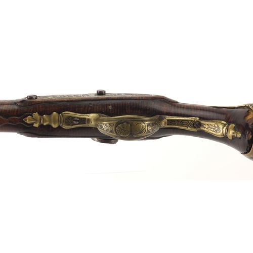 318 - Antique percussion cap pistol, with ornate brass mounts and engraved steel barrel, 42.5cm in length