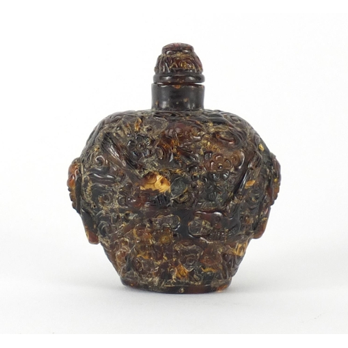 489 - Chinese amber coloured snuff bottle with animalia twin handles, decorated with a birds of paradise a... 