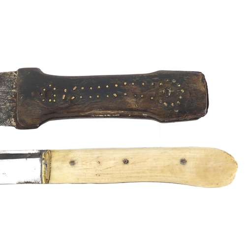 597 - Two Ottoman and Middle Eastern knives comprising a Yatagan with leather sheath and bone handle and o... 